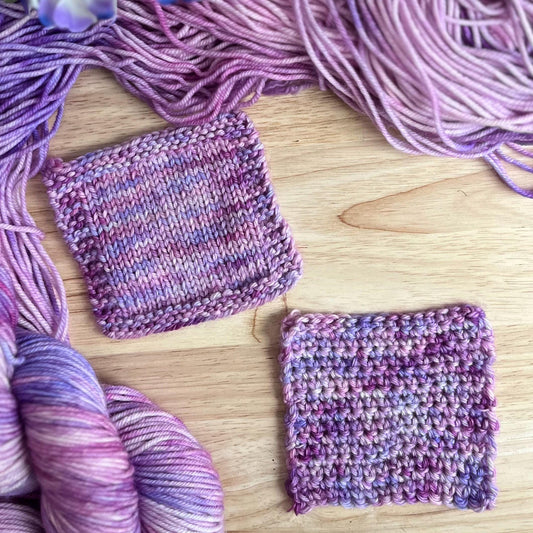 Knit and crochet swatches of variegated hand dyed pink and purple yarn.