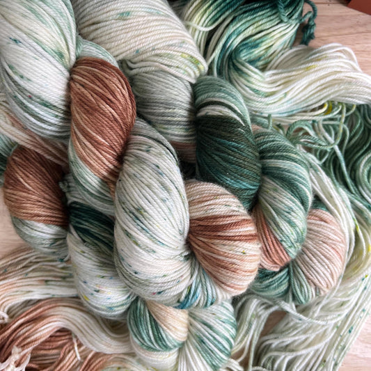 Variegated brown, sage, tan, and green hand dyed yarn 