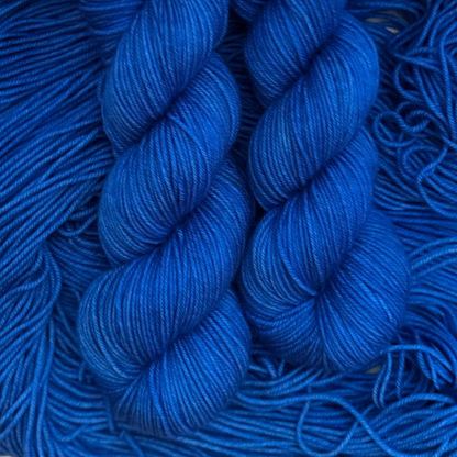 Close-up of blue hand dyed yarn skeins with a blurred background