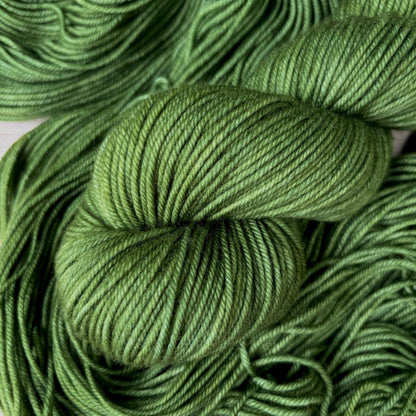 A skein of hand dyed green yarn